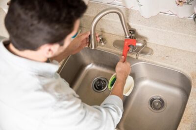 male plumber using wrench tighten water faucet kitchen seen up close 662251 2697 1